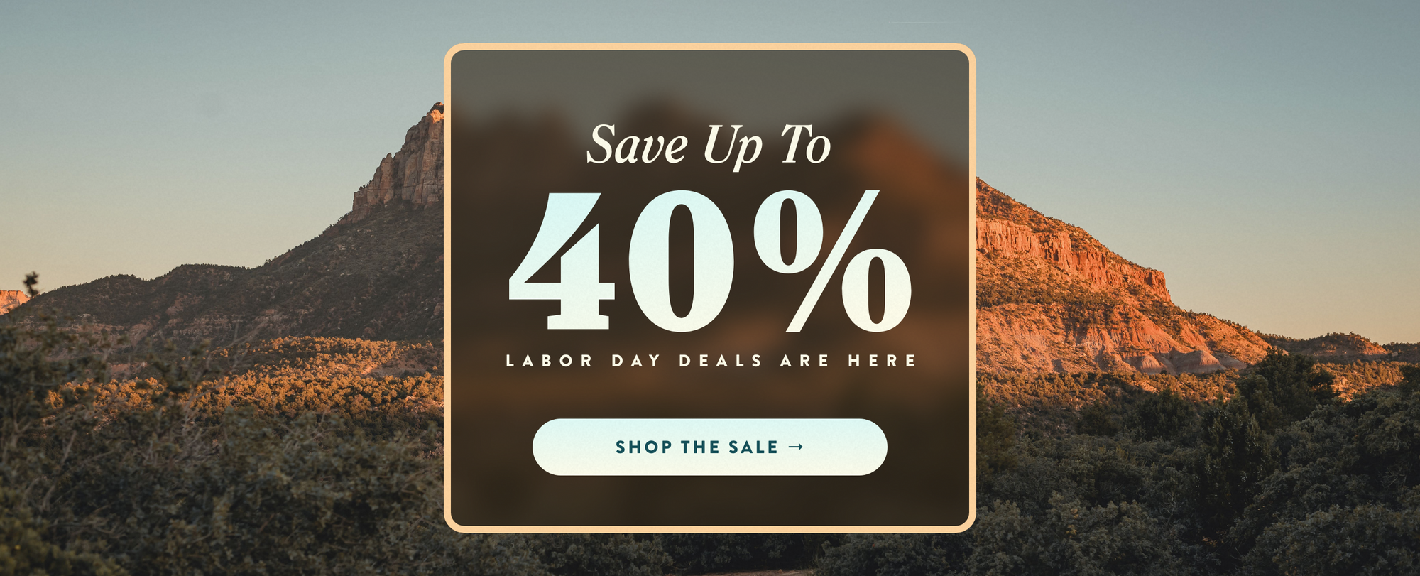 A promotional sale graphic over a mountain landscape at sunset, with large white text reading 'Save Up To 40% Labor Day Deals Are Here' and a 'Shop the Sale' button.