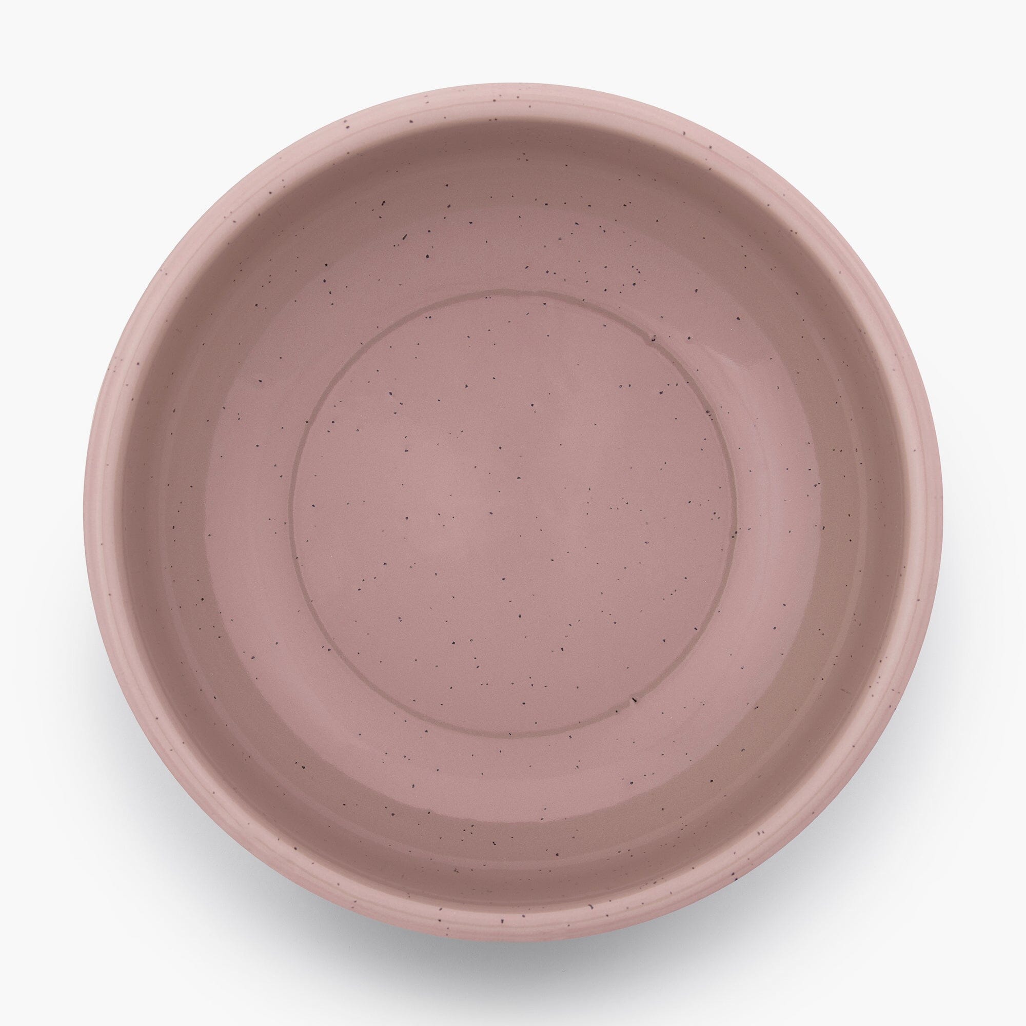 A dusty rose rolled enamel bowl on a white background