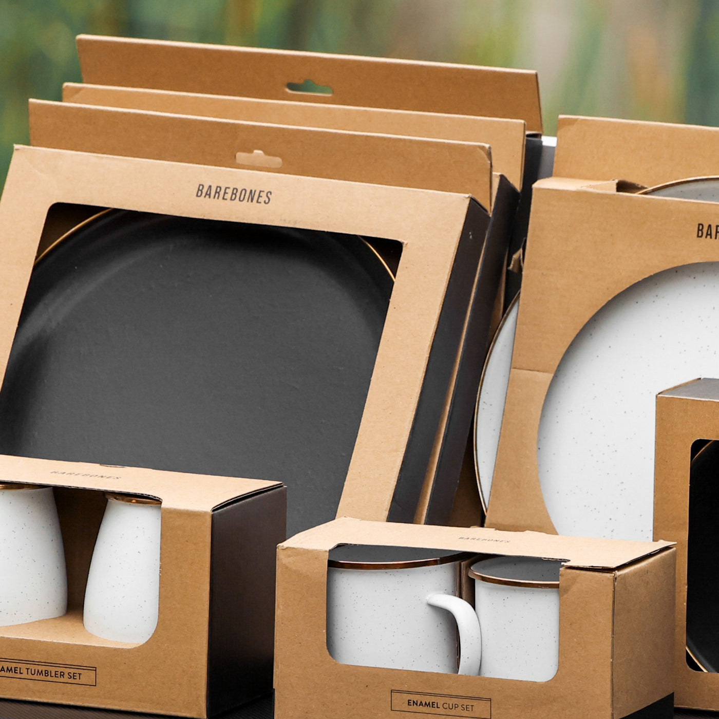 Set of Barebones enamel cookware packaging including a frying pan, tumbler, and cup set.